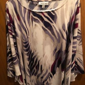 Jennifer Lopez knit top with winged sleeves